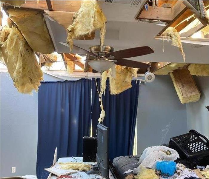 Ceiling damaged, insulation coming out of the ceiling, ceiling tiles collapsed, wet personal items