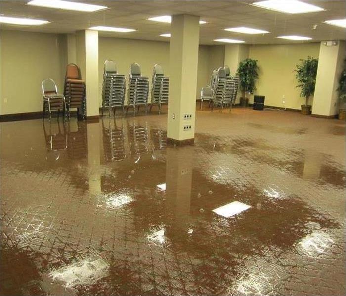 water dripping from ceiling, wet floor of a building