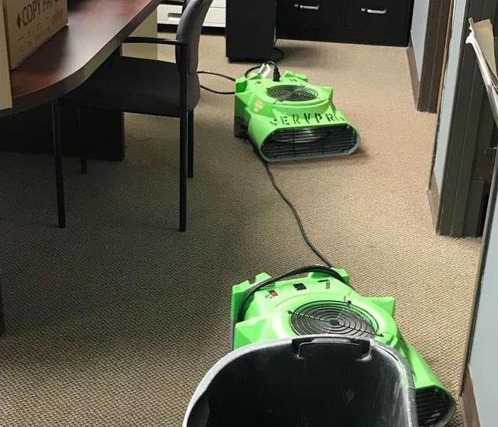 two air movers on a carpet floor